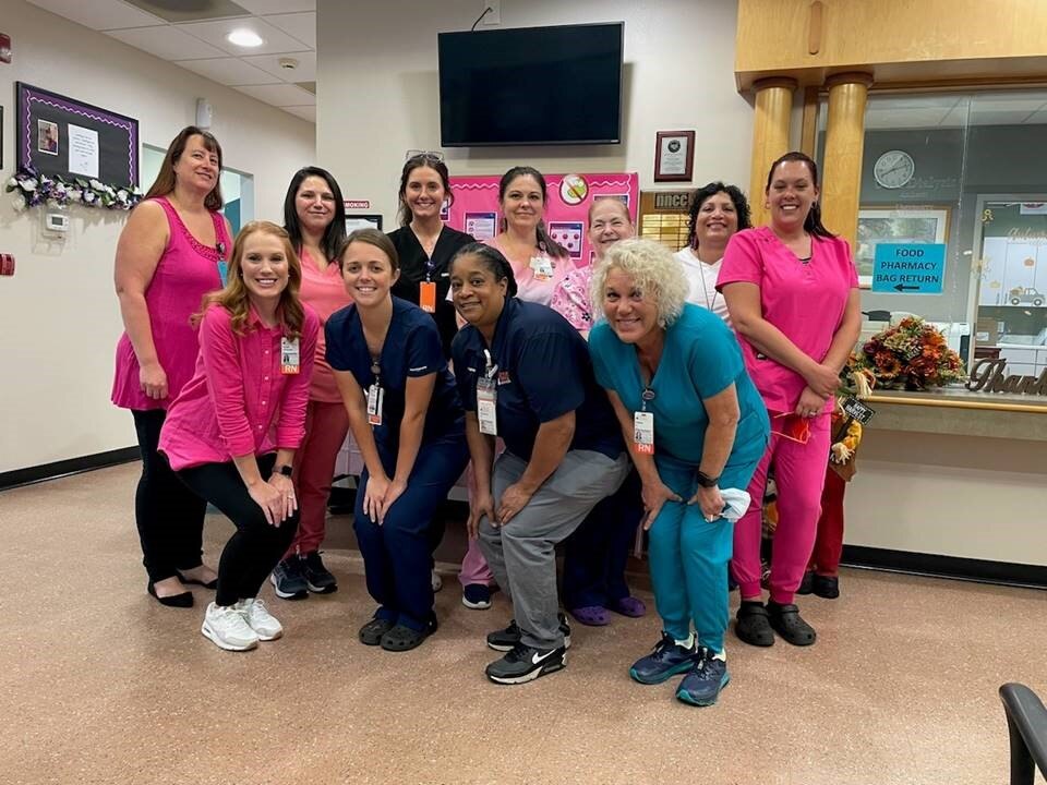 Group of staff poses for sepsis awareness photo